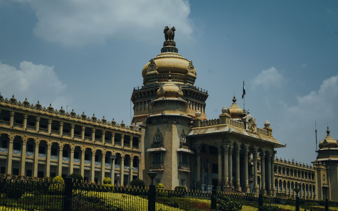 mobile-02 The majestic Vidhana Soudha in Bengaluru captured under a vibrant blue sky.